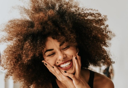 woman sitting and smiling